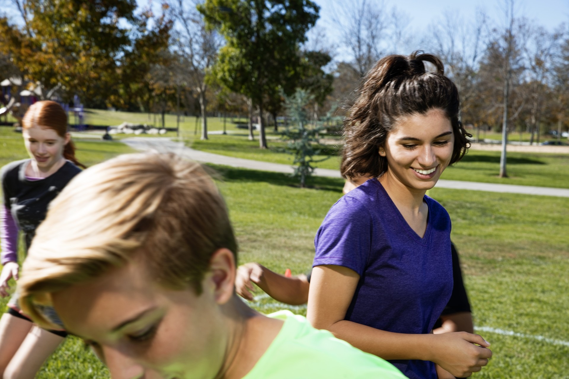 Teens playing soccer