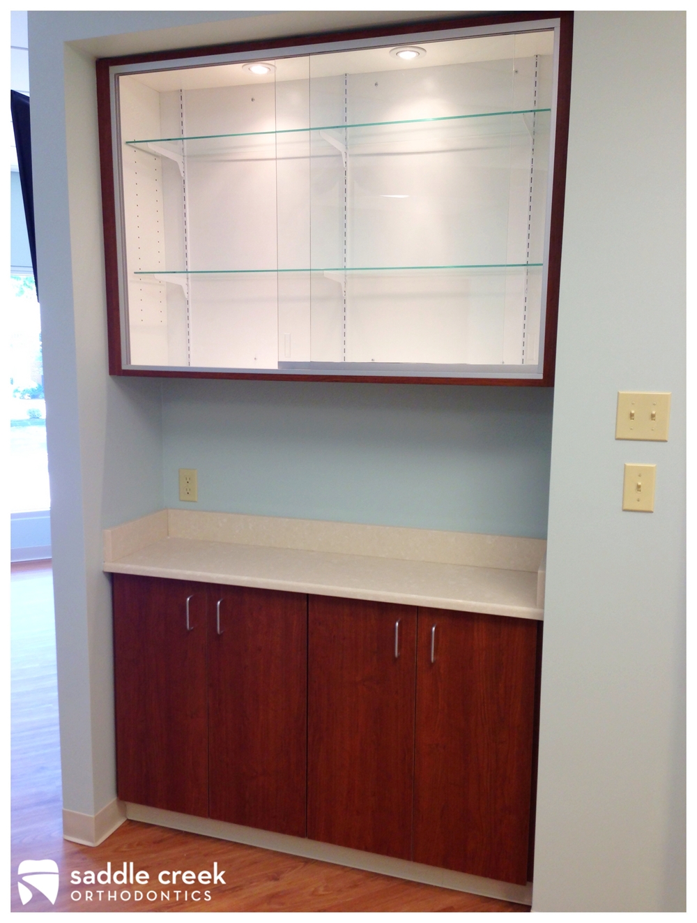 Orthodontic display case for office branded merchandise and case displays